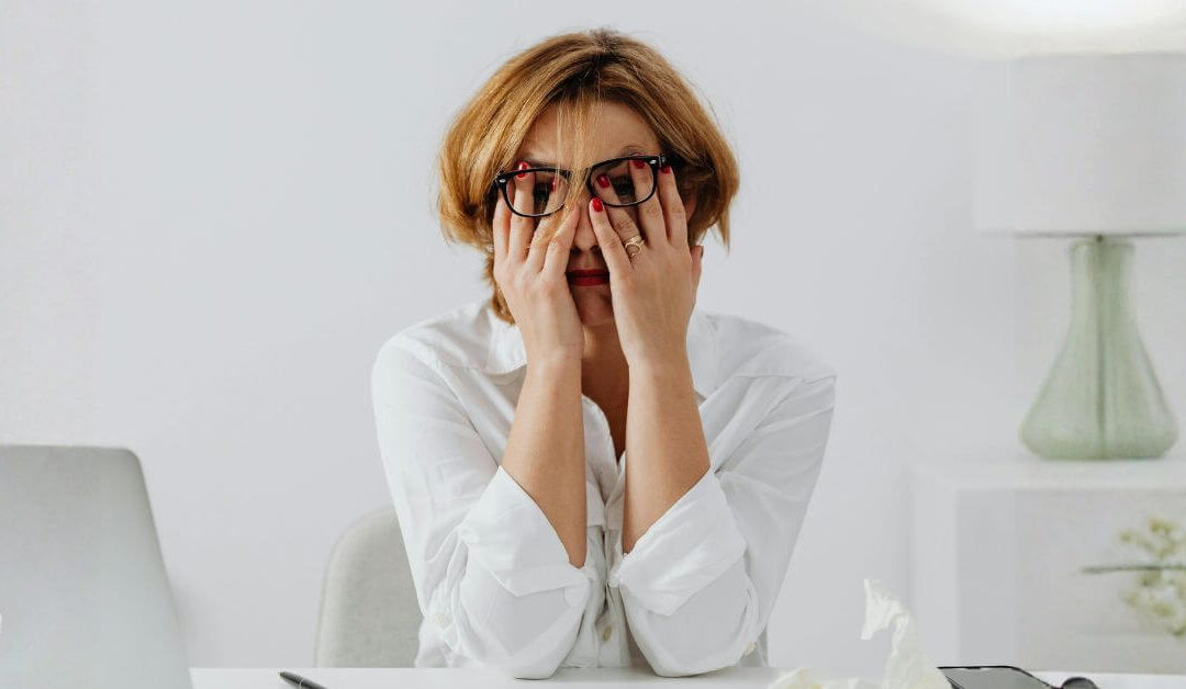 woman with head in her hands